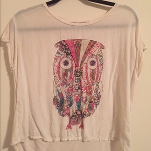 White top with owl print.